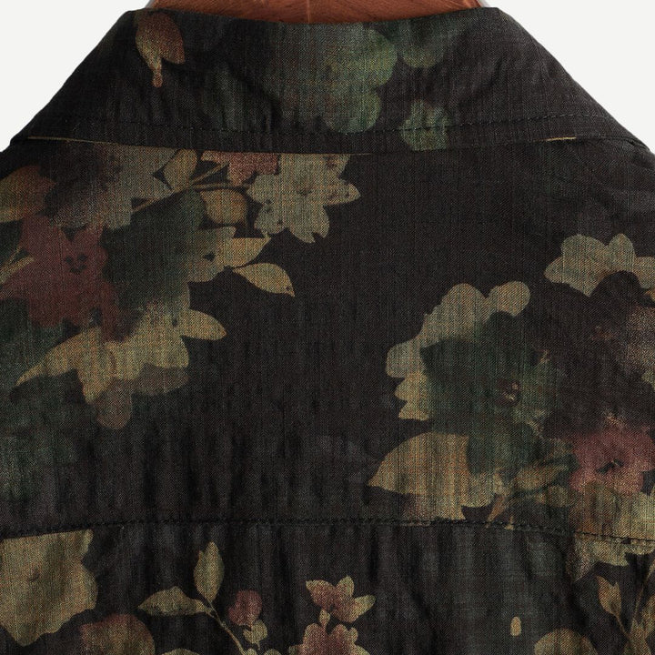Close-up of floral print and button-front detail on men's shirt