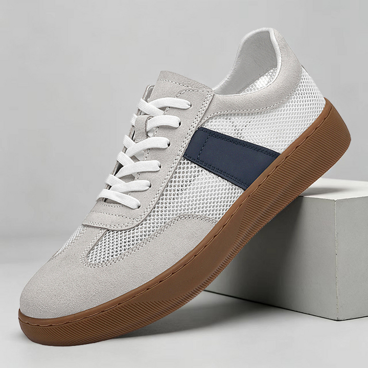 Men's cobalt mesh suede sneakers shown from the side
