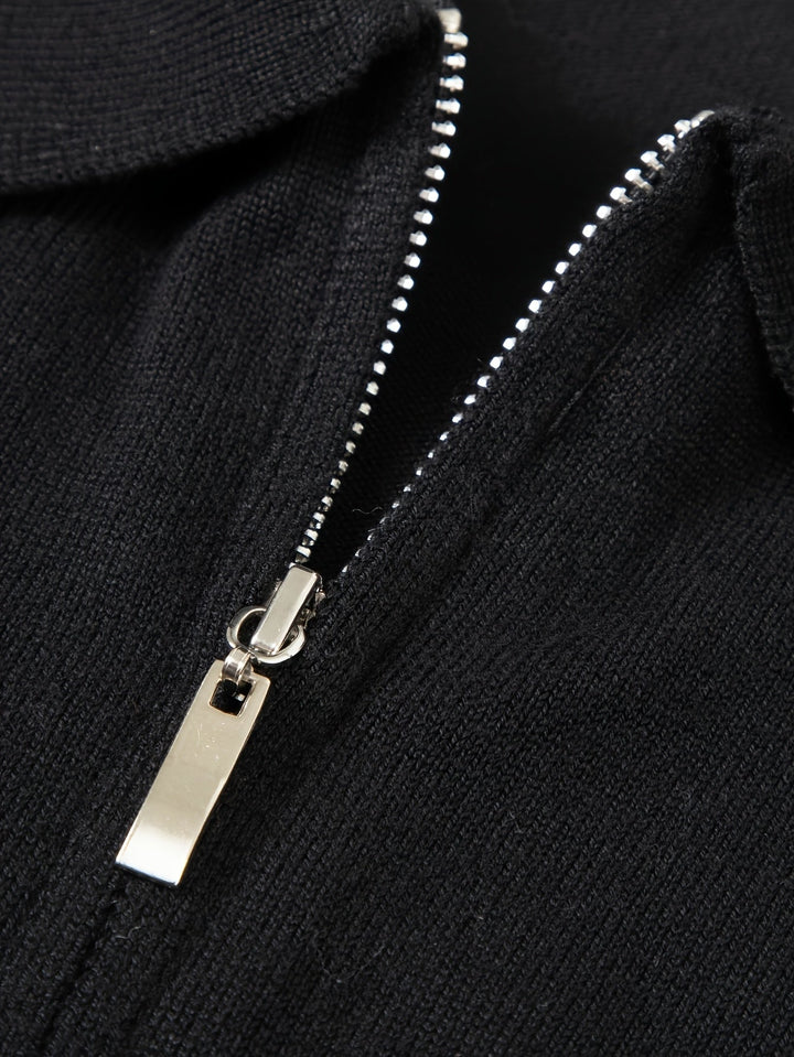 Side view of a men's half zip knitted polo jumper