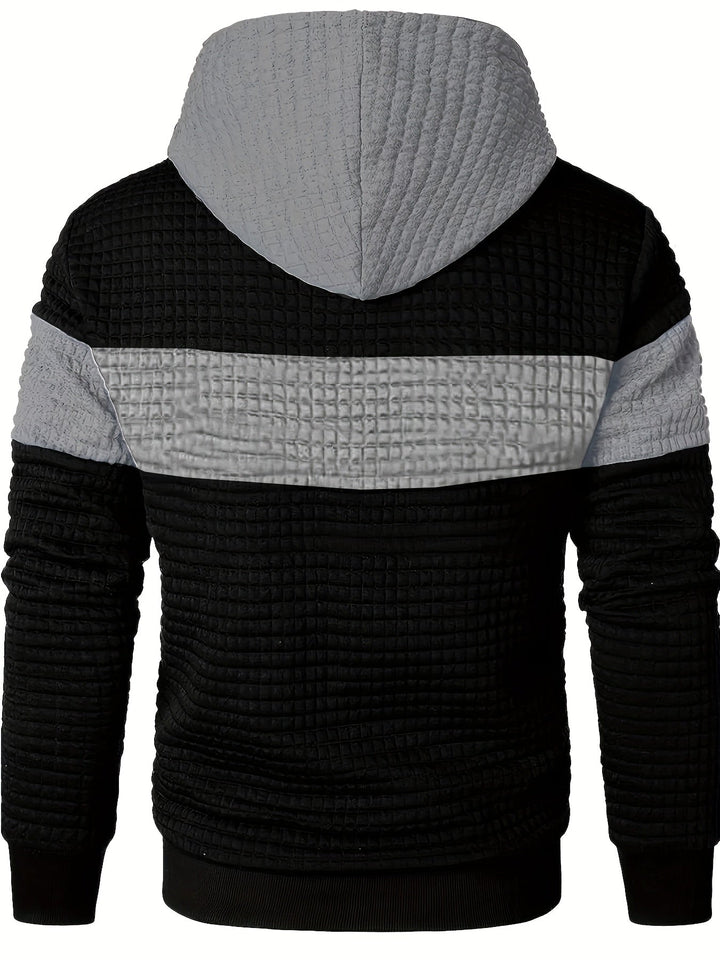 Close-up of the textured gradient fabric on a men's hoodie