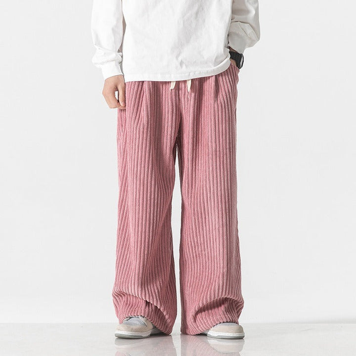 Side view of men's corduroy joggers in a relaxed tapered silhouette