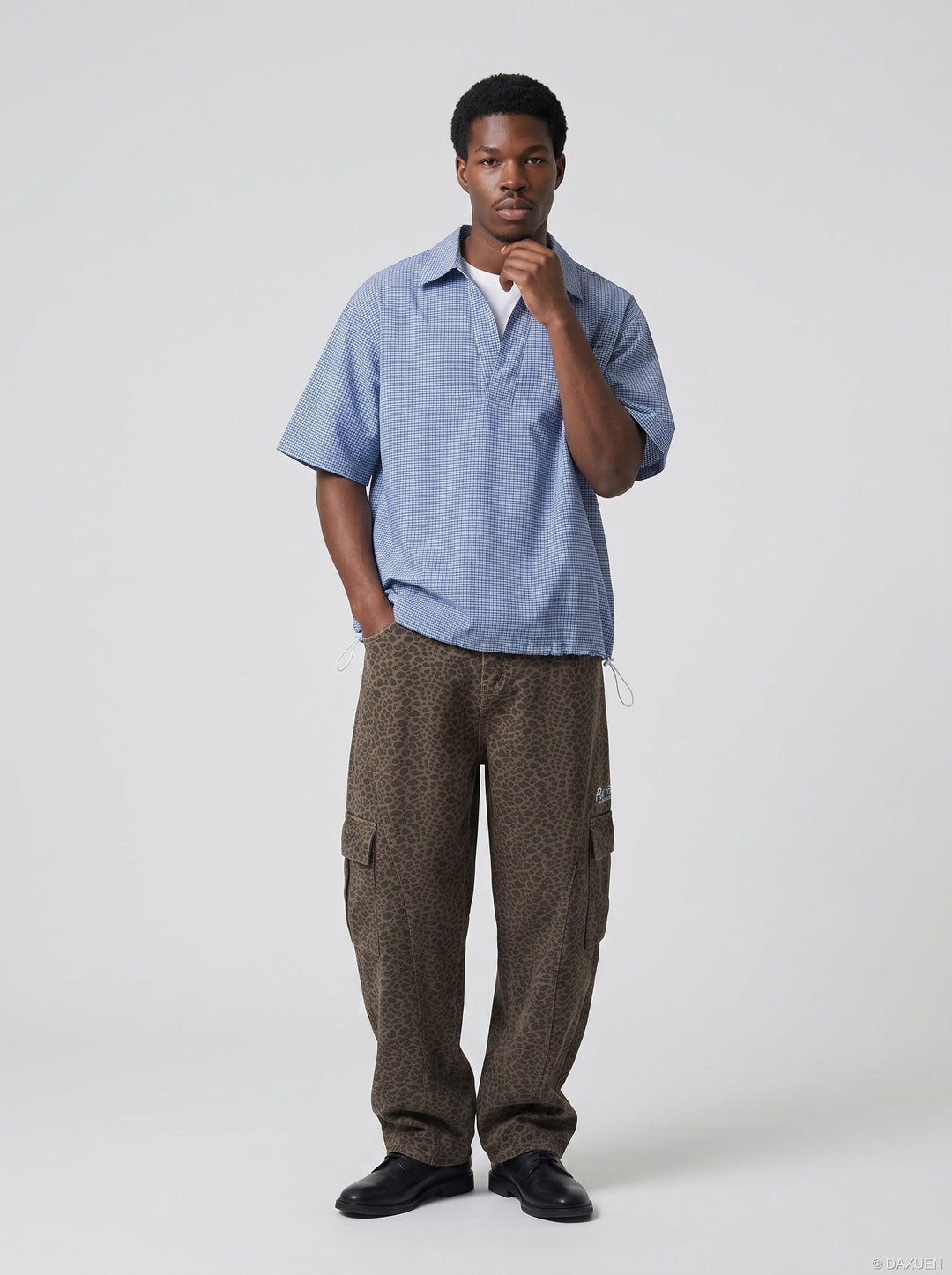 Model wearing men's blue and white check shirt back view