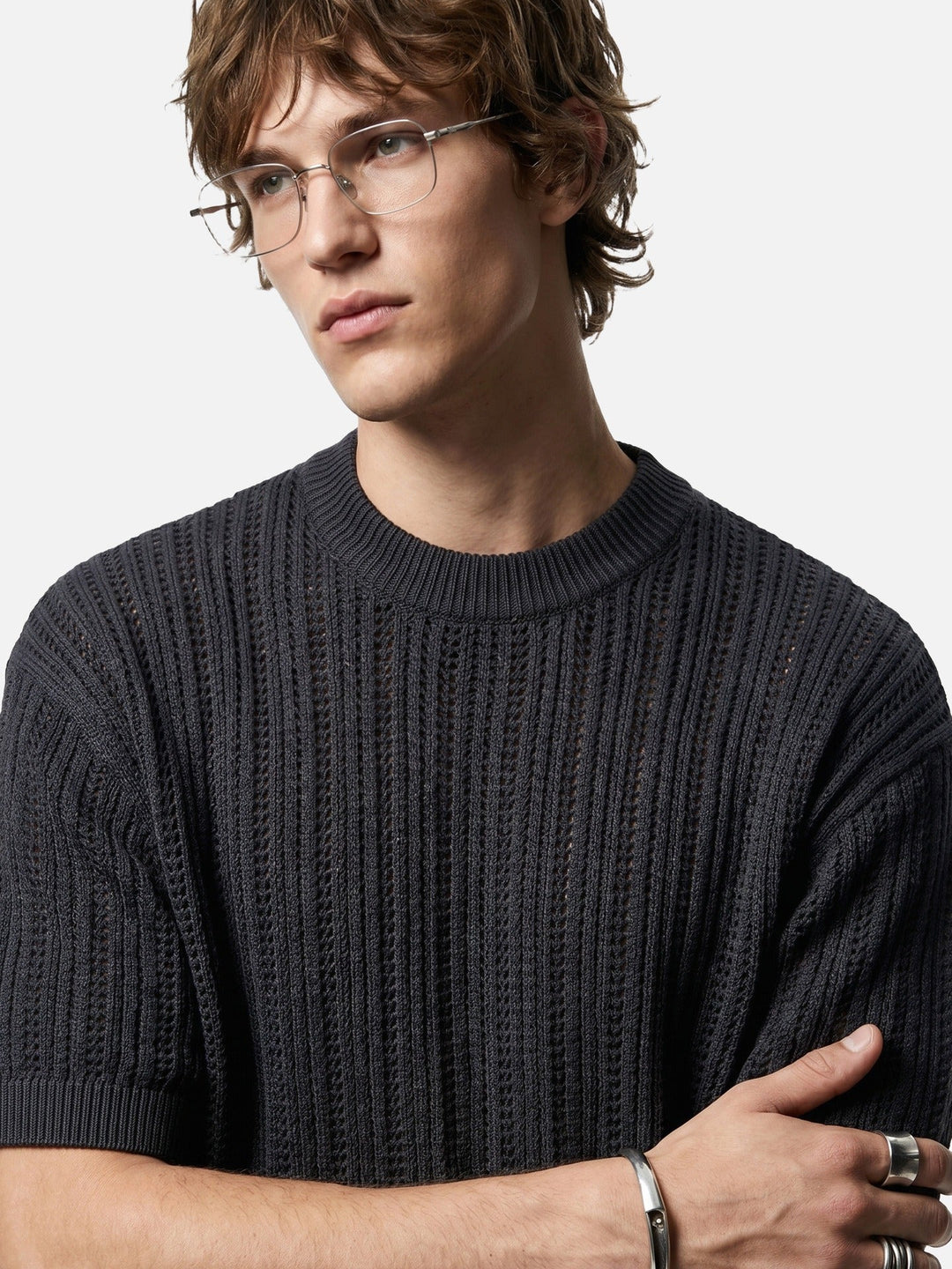 Men's short sleeve knitted top styled on a model