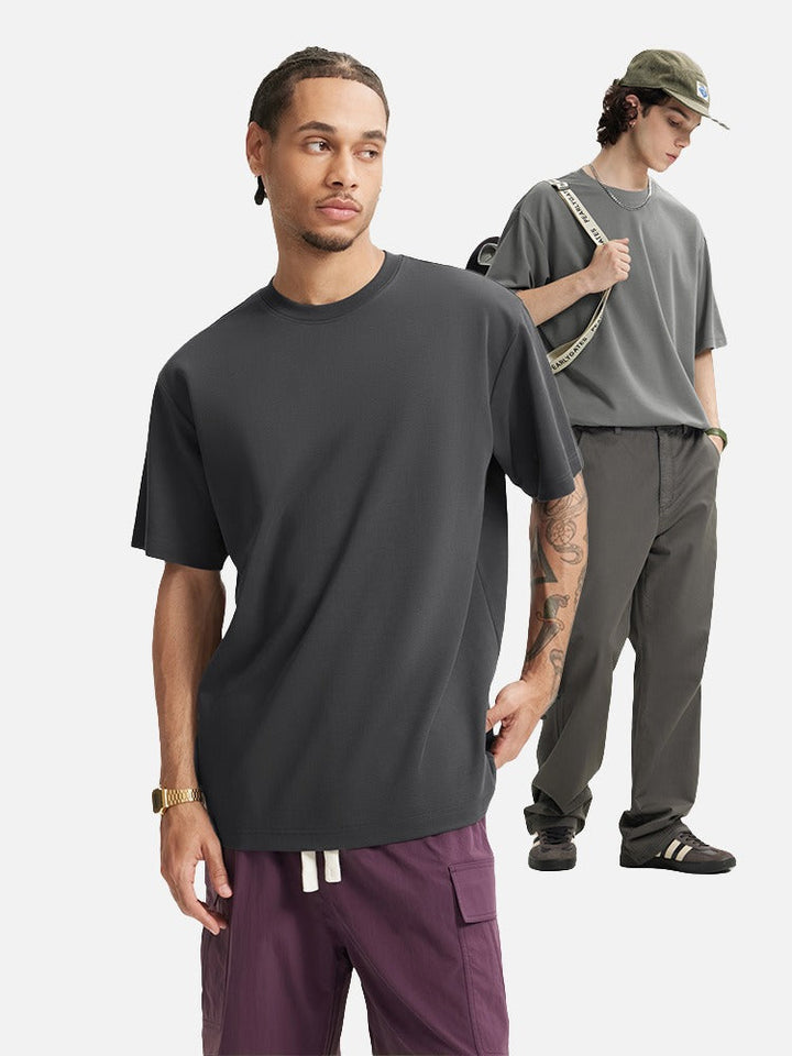 Oversized men's T-shirt showing loose fit through the body and sleeves