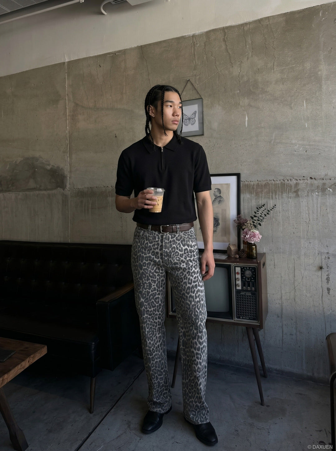 Close-up of the sleeve and cuff detail on the men's knit polo shirt