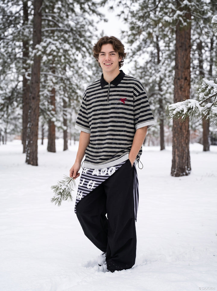 Side view of men's striped zip polo shirt in black and grey