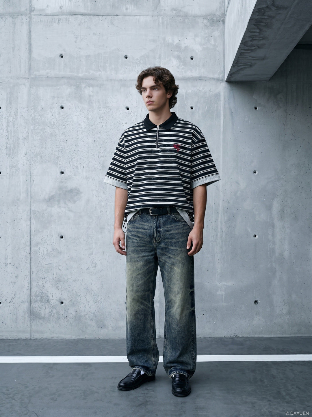Close-up of zip fastening and striped knit on men's polo shirt