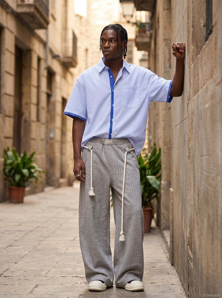 Men's blue striped short sleeve button-up shirt angled front view