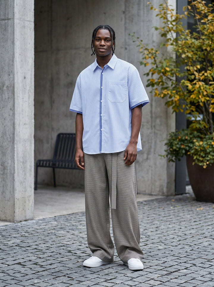 Close-up of blue striped fabric and button placket on men's shirt