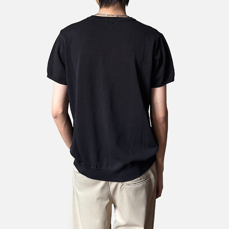 Men's minimalist ribbed T-shirt styled on model, front angle