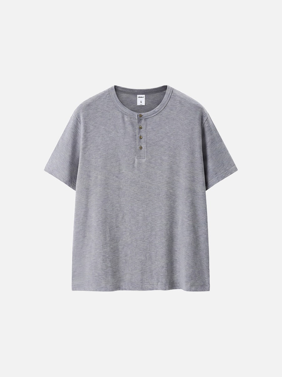 Close-up of men's Henley collar and textured knit finish