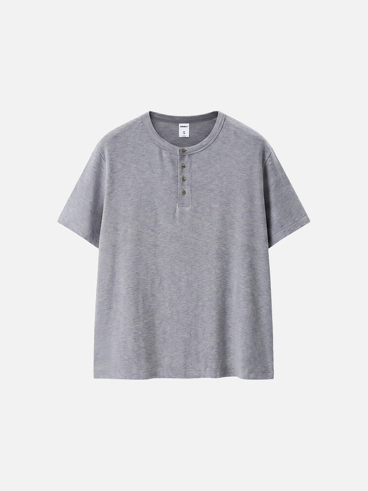 Close-up of men's Henley collar and textured knit finish