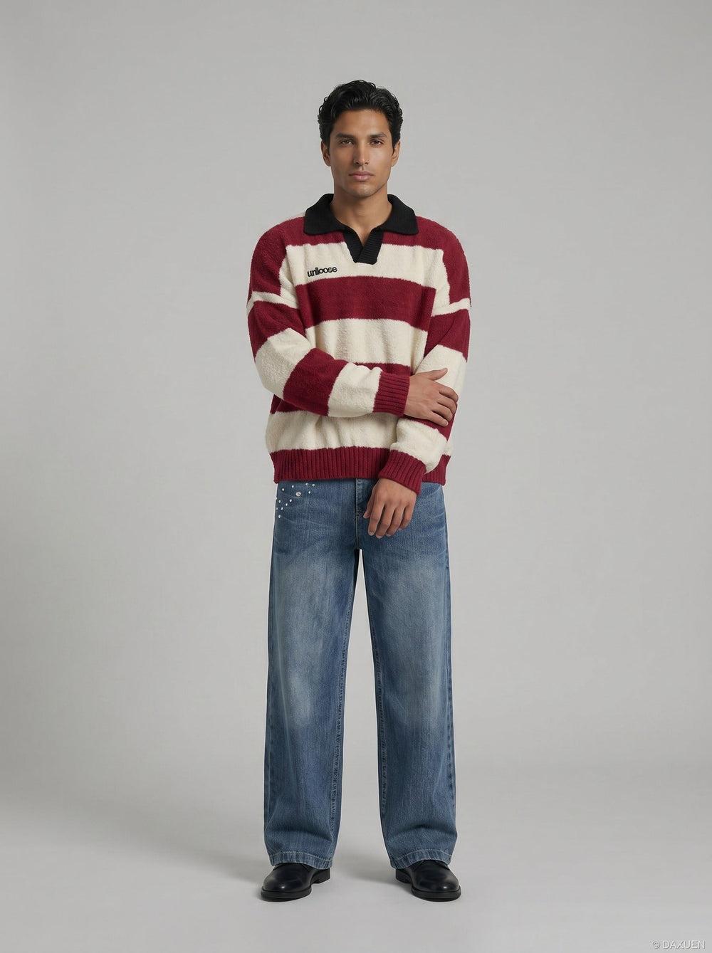 Close-up of the neckline and stripe detailing on the men's knit jumper