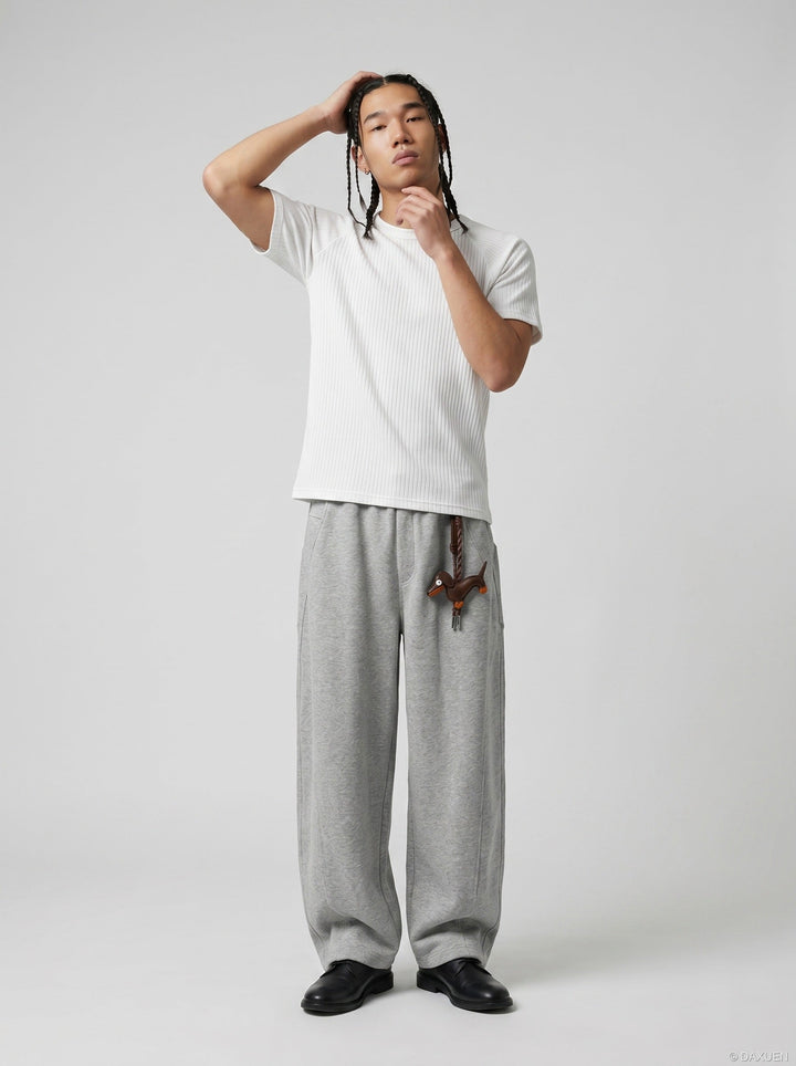 Full-length styling view of the men's white ribbed knit T-shirt with casual outfit