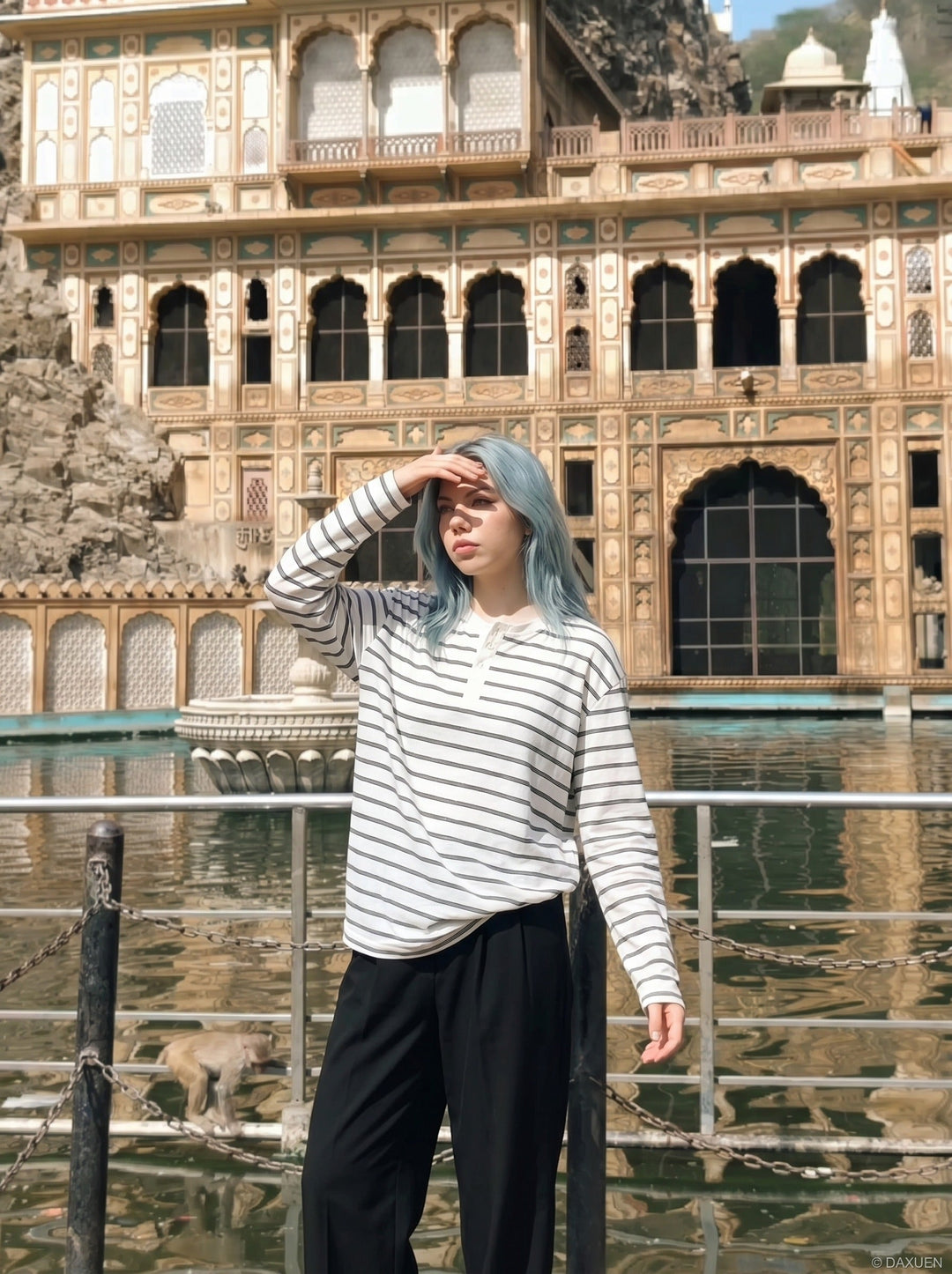 Full-length view of men's white striped Henley shirt styled casually