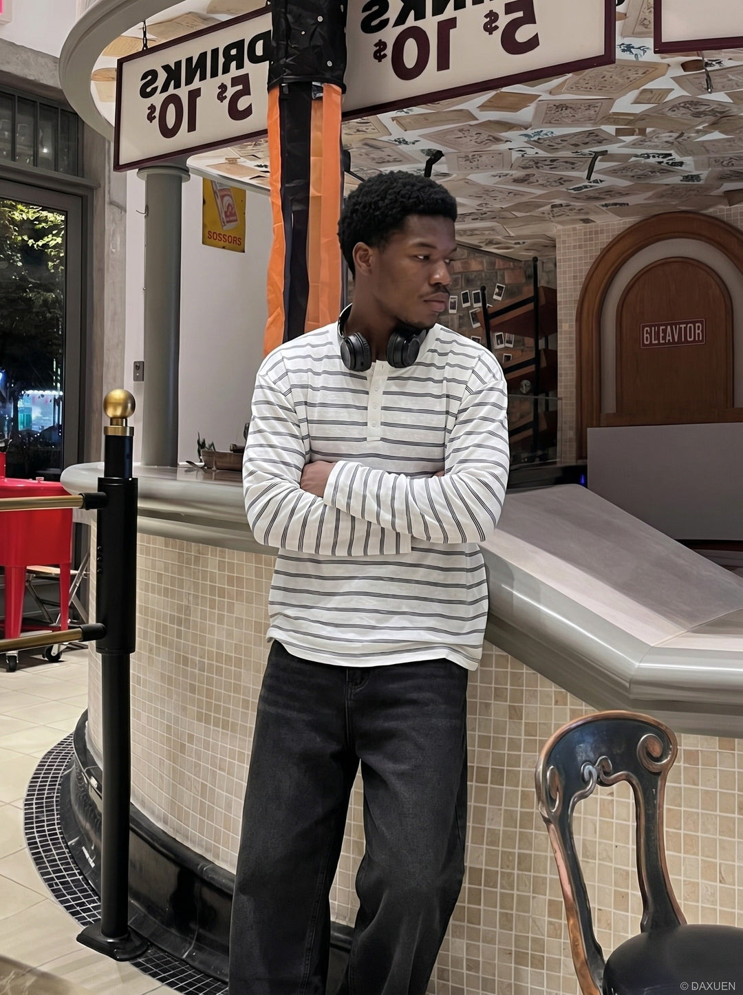 Men's casual white striped Henley shirt displayed on a model