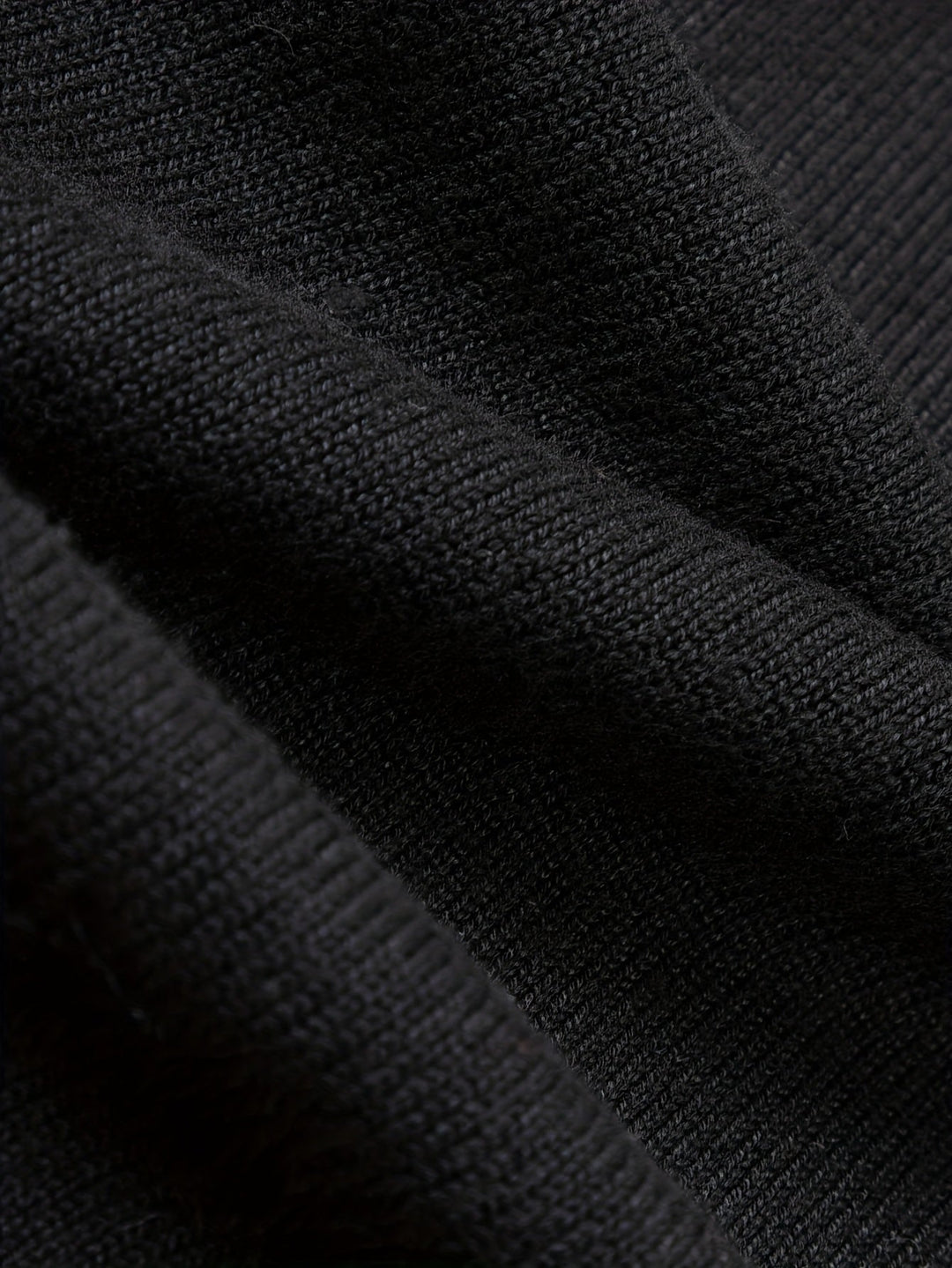 Detail of the ribbed cuffs on a men's knitted jumper