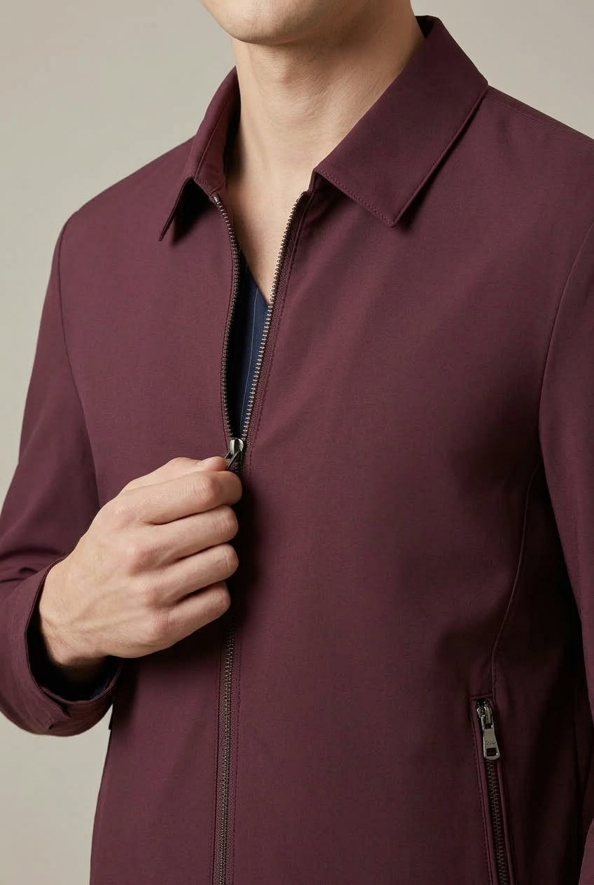 Men's jacket showing the pointed collar and front zip fastening
