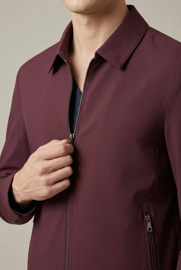 Men's jacket showing the pointed collar and front zip fastening