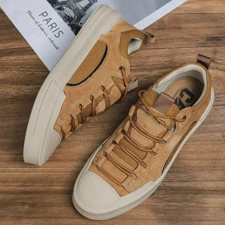 Pair of men's canvas low-top sneakers with lace-up fastening
