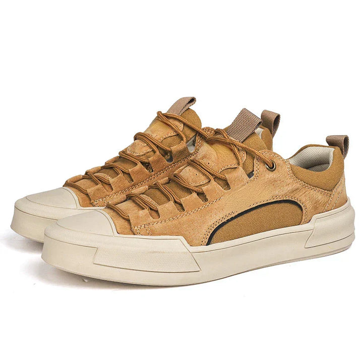 Close-up of men's lace-up canvas sneakers and eyelet detail