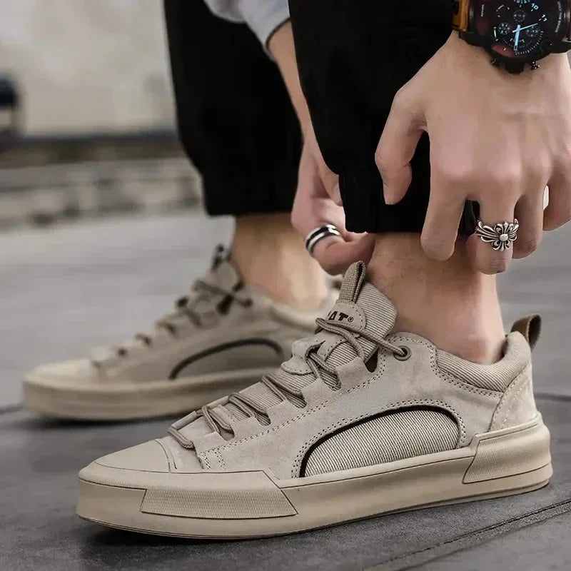 Pair of men's low-top canvas shoes displayed on a plain background