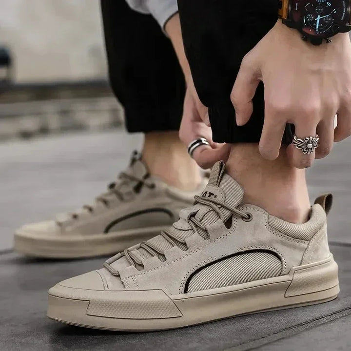 Pair of men's low-top canvas shoes displayed on a plain background