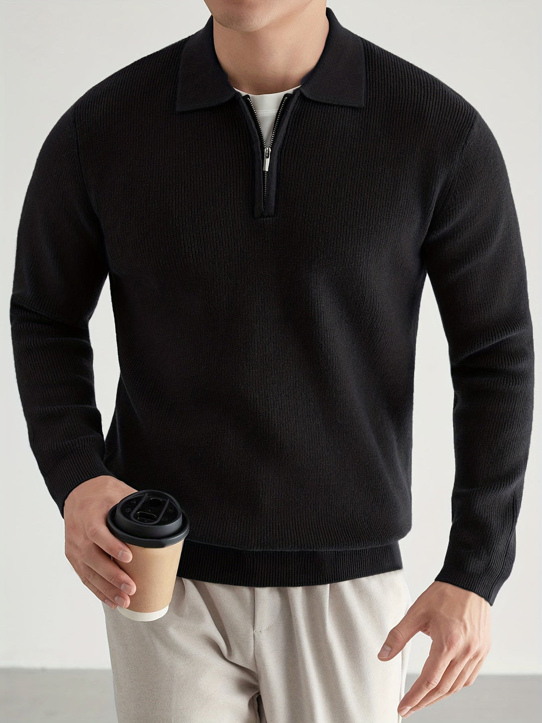 Close-up of the knitted texture on a men's polo jumper