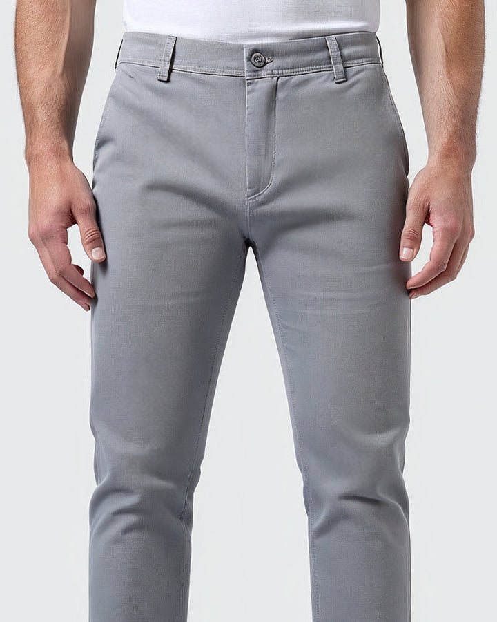 Close-up of tapered leg fit on men's slim chinos