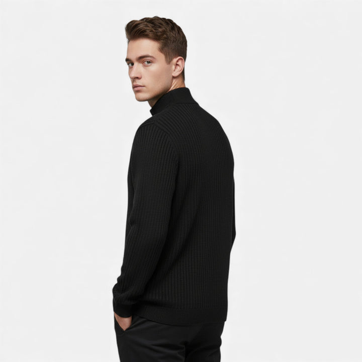 Close-up of the cardigan's knitted texture and zip detail