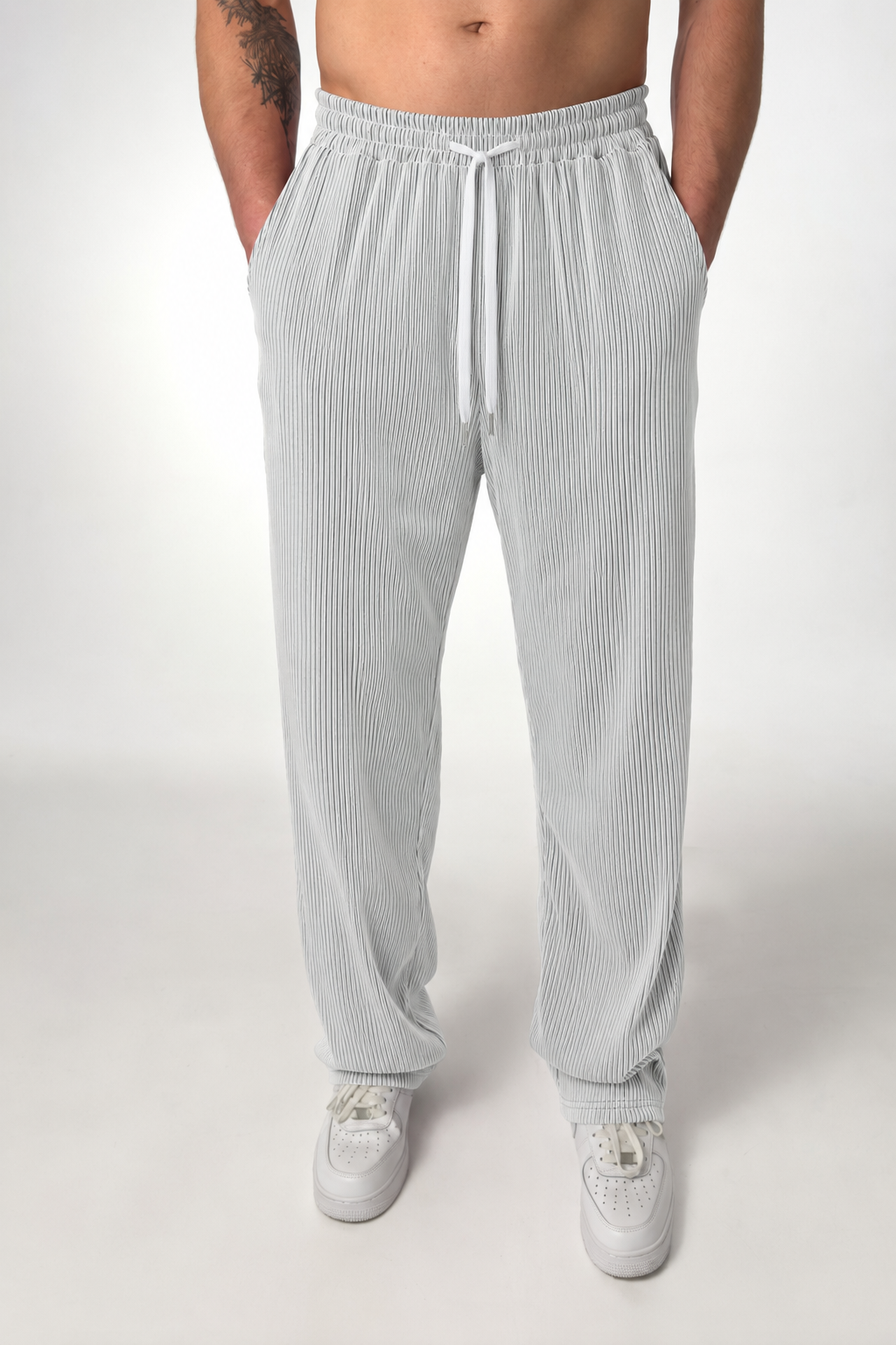Full-length view of men's striped trousers showing the straight-leg silhouette