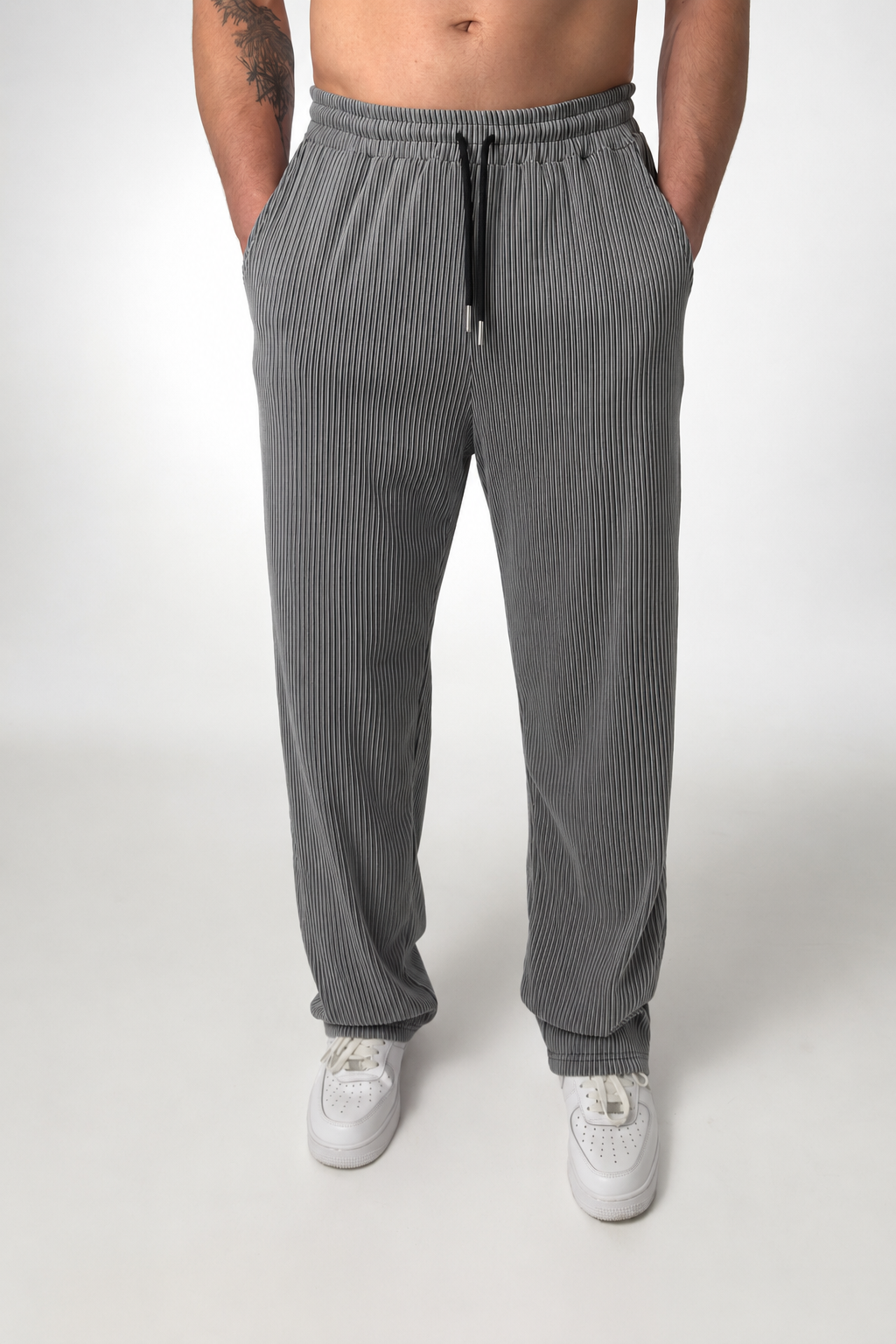 Men's striped straight-leg trousers shown from the back on a plain background