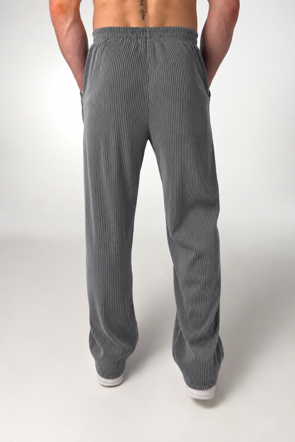 Side view of men's straight-leg striped trousers with a relaxed tailored fit