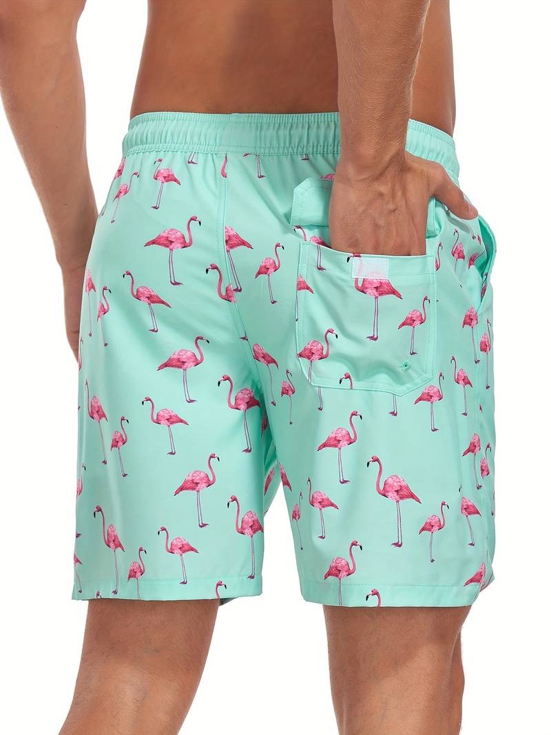 Close-up of flamingo print fabric on men's relaxed fit swim shorts
