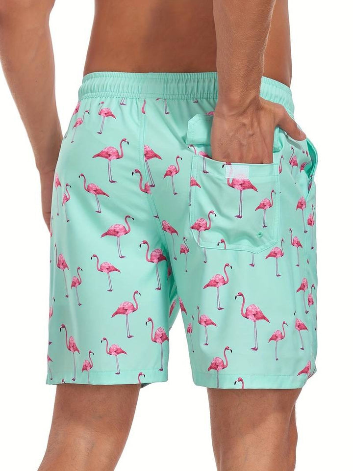 Close-up of flamingo print fabric on men's relaxed fit swim shorts