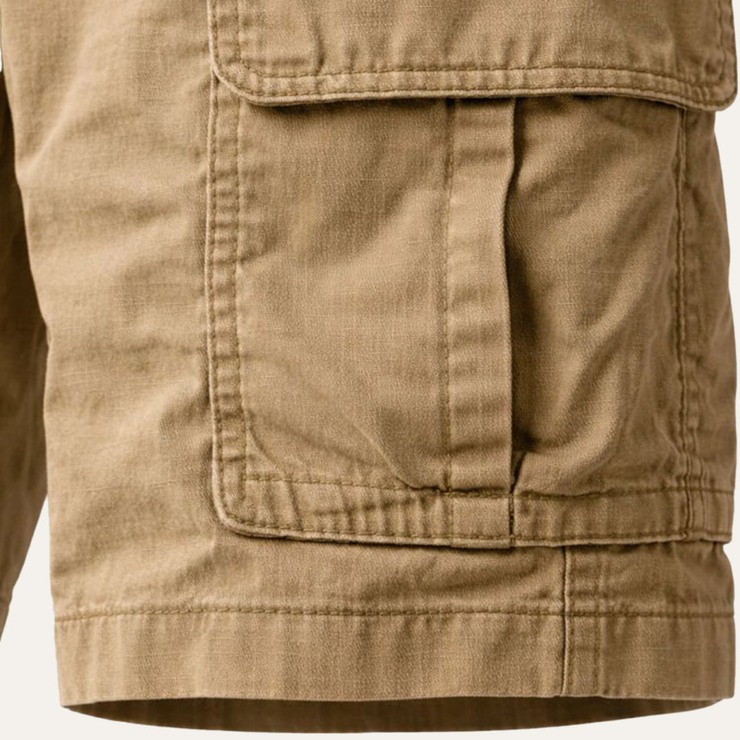 Close-up of men's cargo shorts pocket and stitching detail