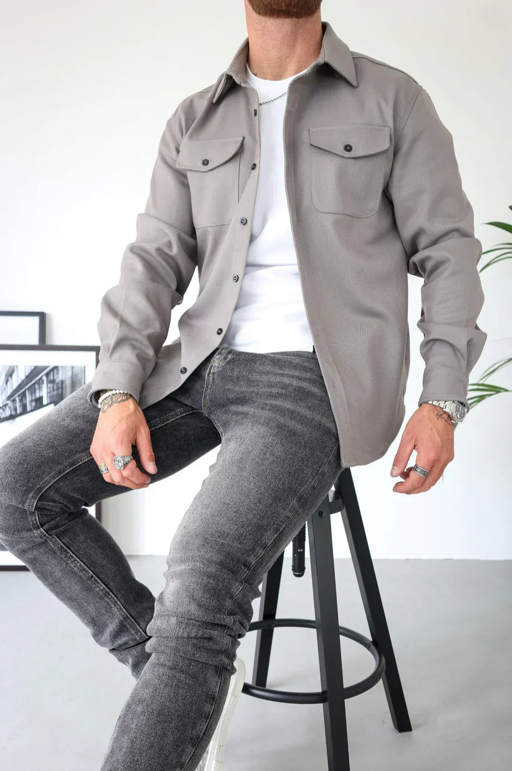 Close-up of the overshirt's classic collar and button fastening