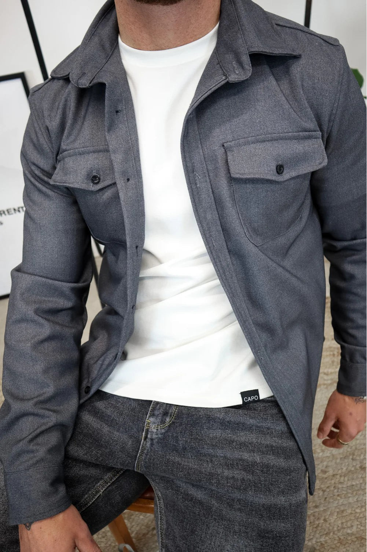 Detail of the overshirt's long sleeve and buttoned cuff