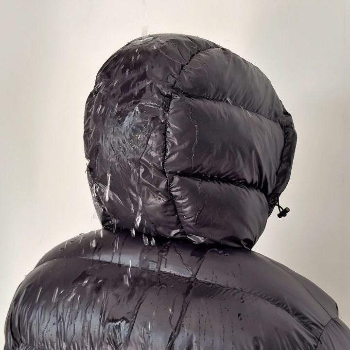 Men's hooded puffer jacket shown from the back
