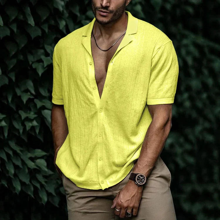 Men's relaxed fit short sleeve shirt shown on a model, side view