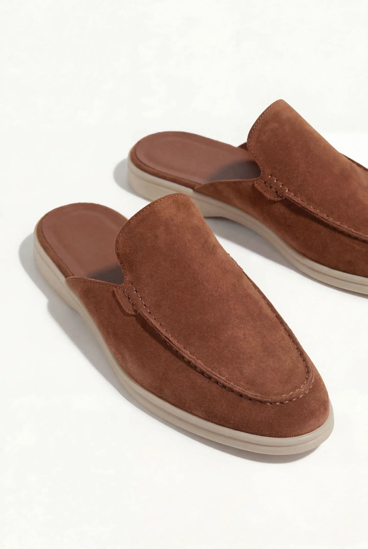 Front angled view of men's suede leather slip-on mules in a classic style