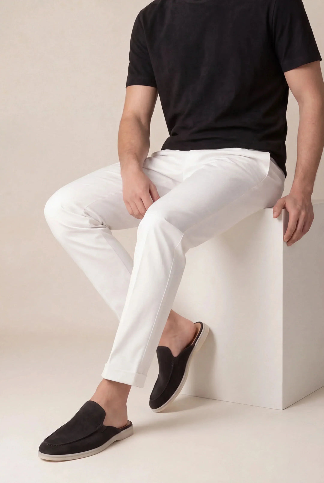 Side view of suede mule sandals showing the open toe and flat sole