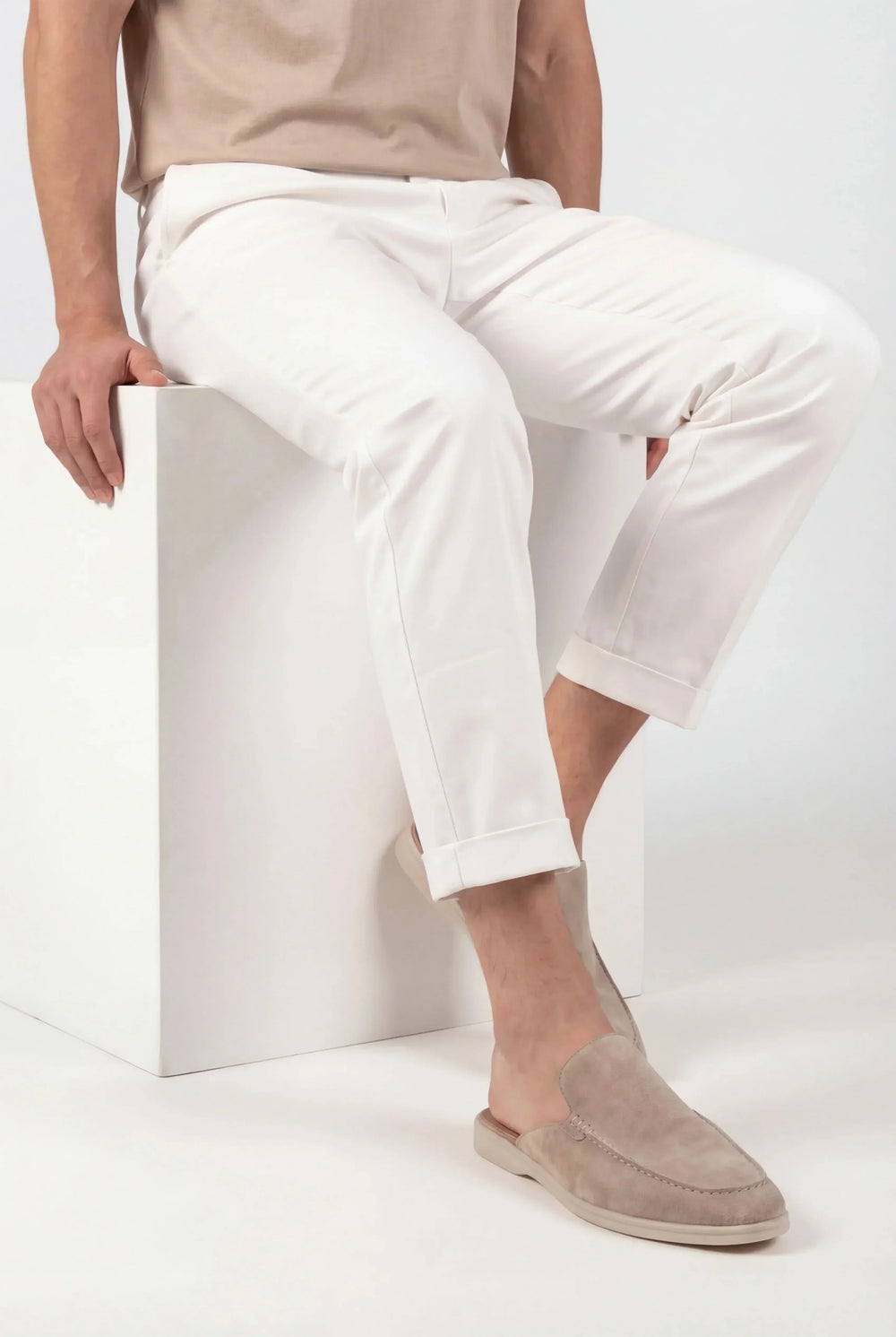 Pair of men's suede mule sandals showing open-back design and wide straps