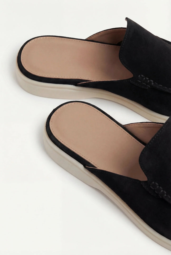 Angled view of stylish suede mule sandals for casual summer wear
