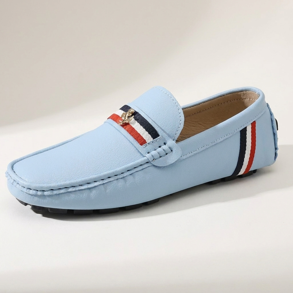 Pair of men's striped slip-on loafers from an angled front view
