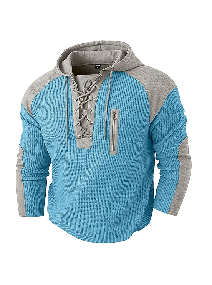 Close-up view of the hoodie neckline and contrast panels