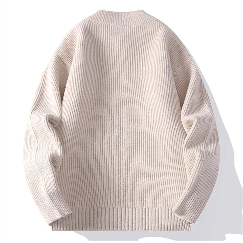 Detailed view of the cardigan's ribbed knit front and long sleeves