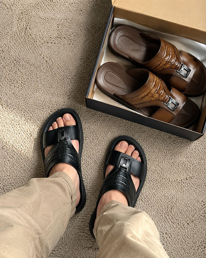 Side view of men's slider sandals with croc effect and buckle detail