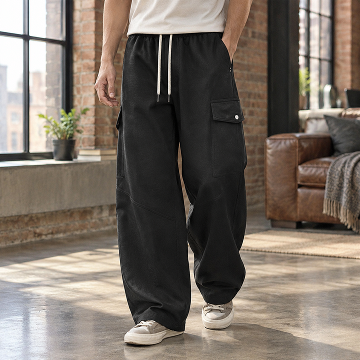 Men's wide-leg cargo trousers with a drawstring waist and utility pockets