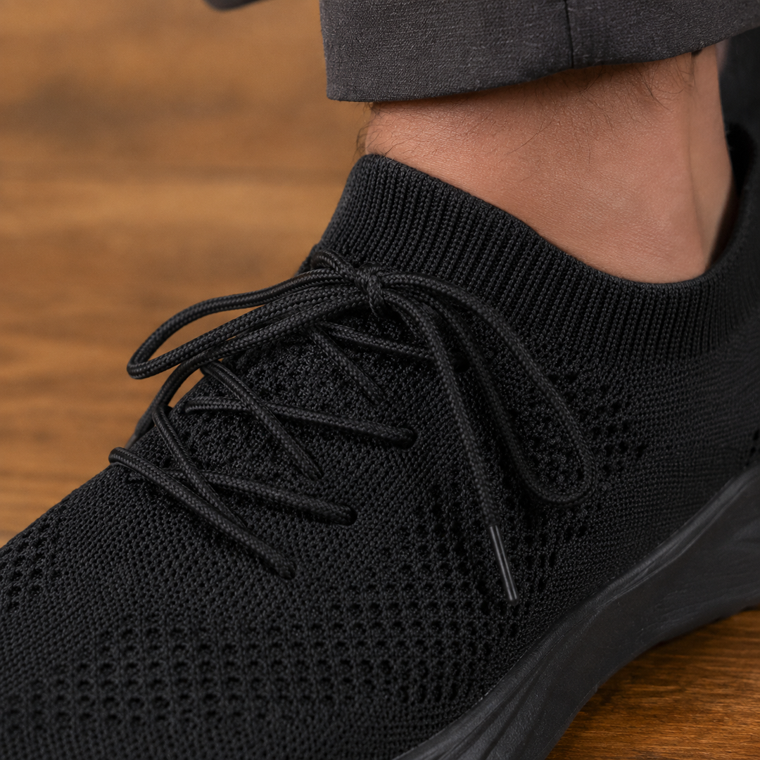 Pair of men's knit sneakers displayed together in a clean product view